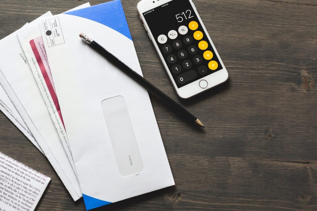 Bills and a calculator for accounts receivable follow-up