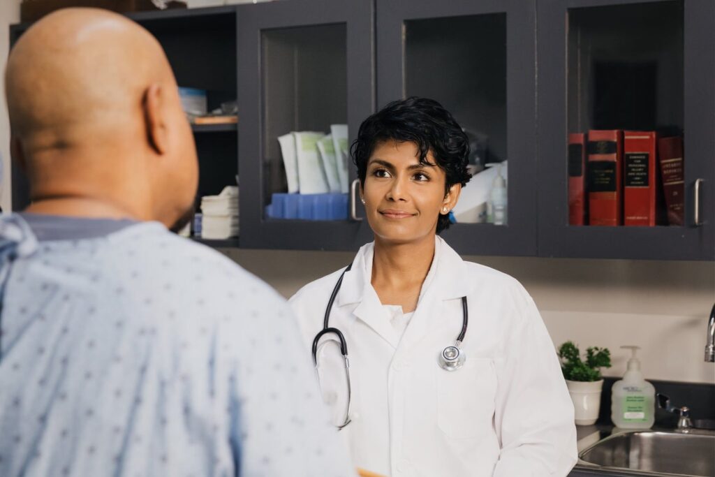 Doctor talking with a patient about coverage