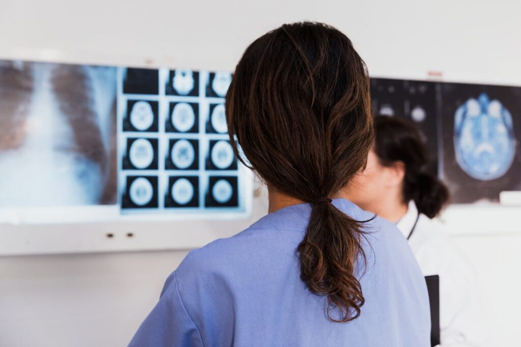 Clinicians reviewing imaging results